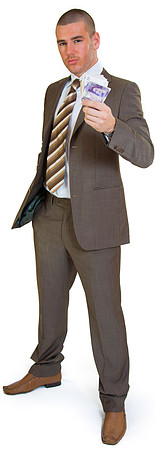Sucessful young businessman holding a wad of money