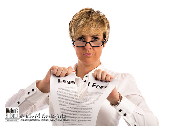 A determined business woman rips up a legal fees document