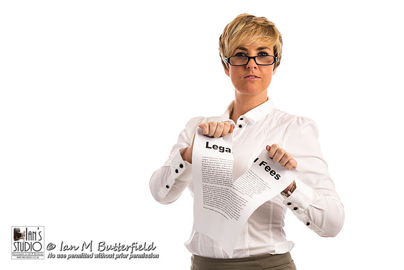 A happy business woman rips up her legal fees