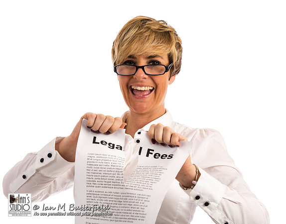 A happy business woman rips up her legal fees