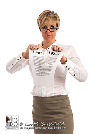 A determined business woman rips up a legal fees document