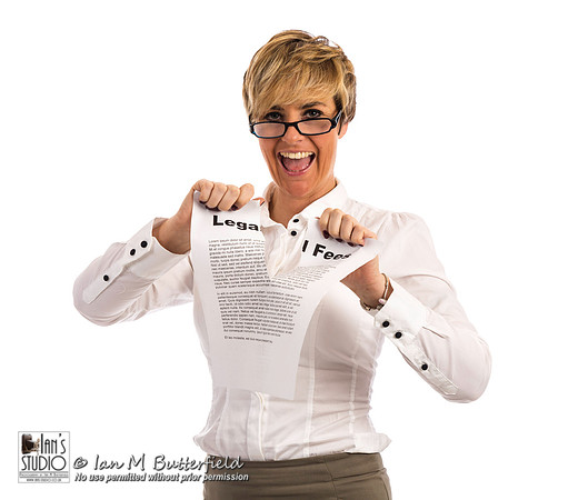 A happy business woman rips up her legal fees