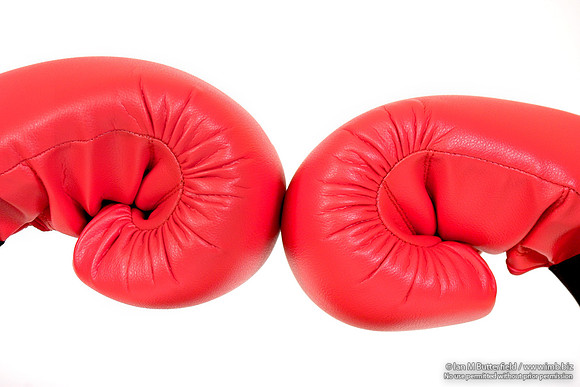 EY0219B-D00657 : Boxing gloves on the hands of a teenage female boxer