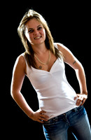 FA0718A-E07741 : Young woman wearing a white tope against a black background
