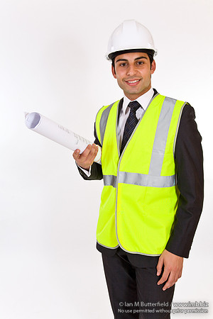 FA0718H-E08388 : Architect - man in hard hat high visibility jacket and holding plans