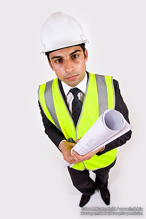 FA0718H-E08382 : Architect - man in hard hat high visibility jacket and holding plans
