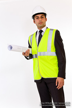 FA0718H-E08393 : Architect - man in hard hat high visibility jacket and holding plans