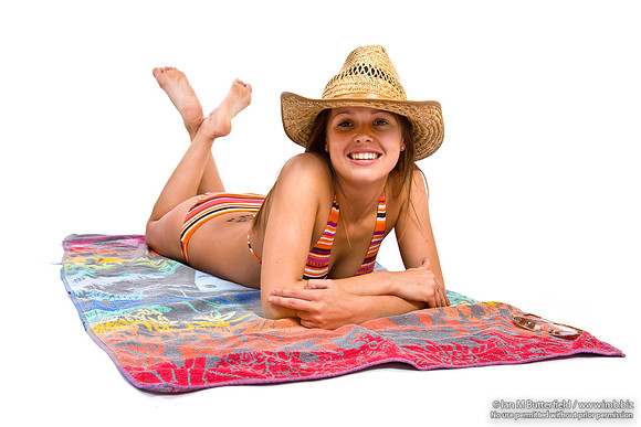 FA0718G-E08369 : Cut out of young sexy woman in a bikini lying on a towel