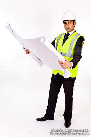 FA0718H-E08401 : Architect - man in hard hat high visibility jacket and holding plans