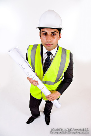 FA0718H-E08378 : Architect - man in hard hat high visibility jacket and holding plans
