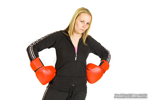 FA0308A-E02219 : A woman boxer wearing a black track suit