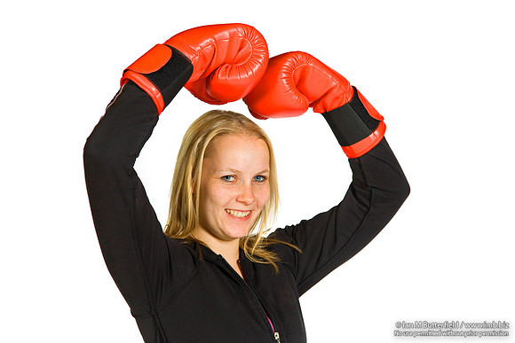 FA0308A-E02224 : A woman boxer wearing a black track suit