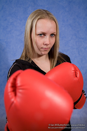 FA0308A-E02170 : A woman boxer wearing a black track suit