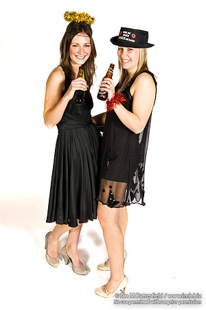 FA0308A-E02247 : Two party girls wearing black dresses and holding bottles of beer