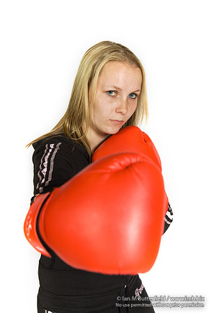 FA0308A-E02232 : A woman boxer wearing a black track suit