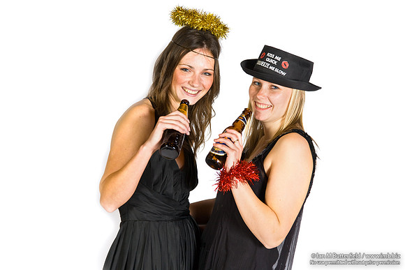 FA0308A-E02244 : Two party girls wearing black dresses and holding bottles of beer