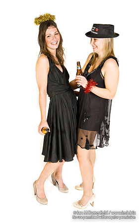 FA0308A-E02242 : Two party girls wearing black dresses and holding bottles of beer