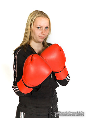 FA0308A-E02228 : A woman boxer wearing a black track suit