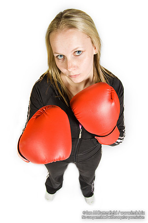FA0308A-E02233 : A woman boxer wearing a black track suit