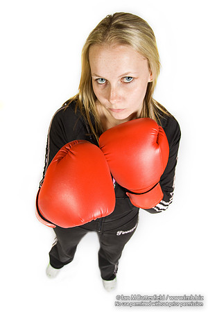 FA0308A-E02234 : A woman boxer wearing a black track suit
