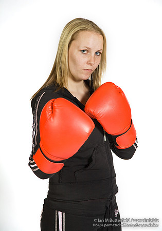 FA0308A-E02214 : A woman boxer wearing a black track suit
