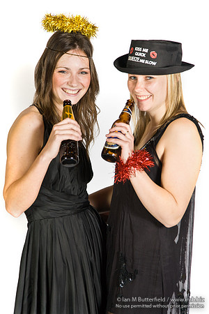 FA0308A-E02246 : Two party girls wearing black dresses and holding bottles of beer