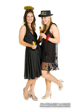 FA0308A-E02239 : Two party girls wearing black dresses and holding bottles of beer
