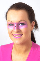 Brunette model with pink make-up round her eyes.