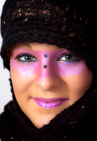 Pink make-up round the eyes and wearing a scarf