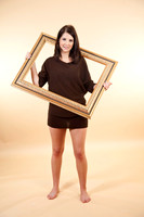 Attractive young woman with a picture frame