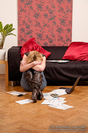 Young woman worried about her debts