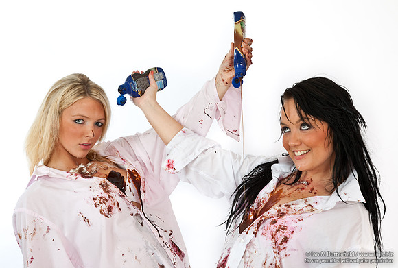 FB0814E-E04933 : Two sexy young woman having a food fight