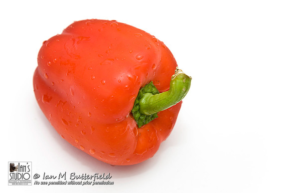 A red pepper on a white background