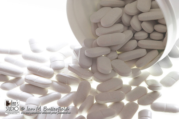 Glucosamine Sulphate tablets on a white background