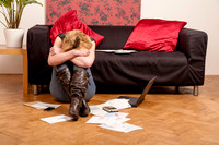 Young woman worried about her debts
